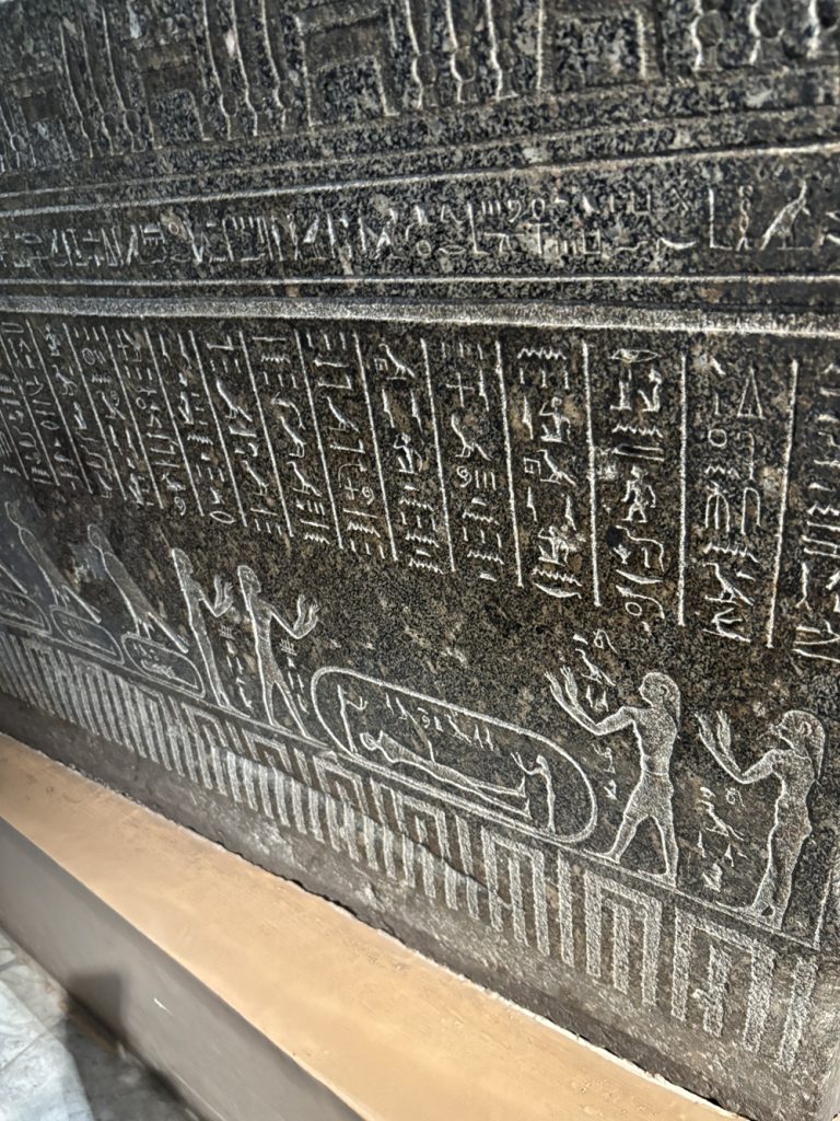 Ancient hieroglyphics carved in stone at Egyptian Museum of Antiquities